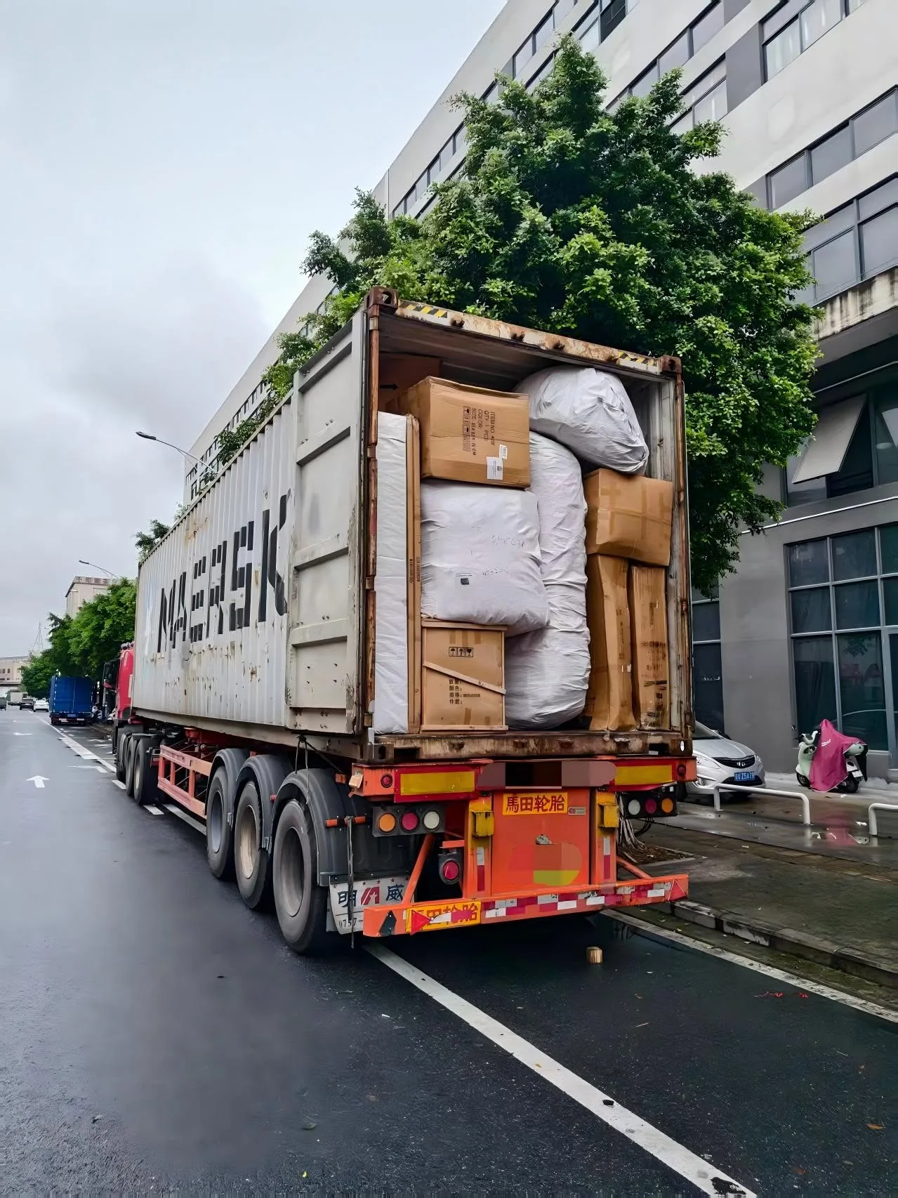 Furniture packages loaded into a shipping container